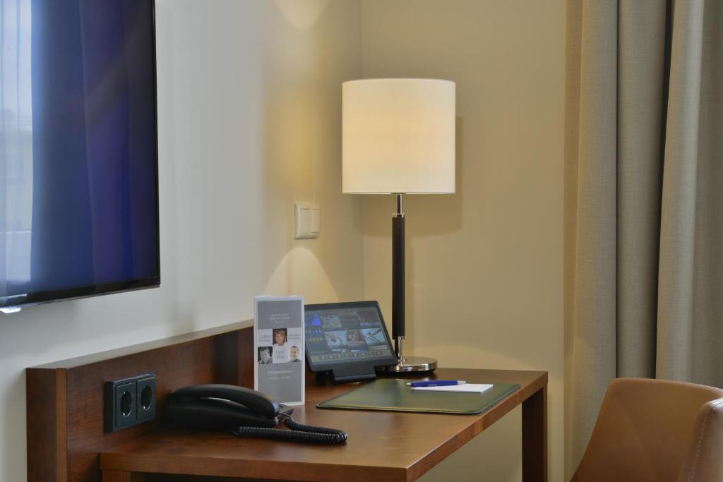 Televiisor ja/või meelelahutuskeskus majutusasutuses Hotel Der Lindenhof