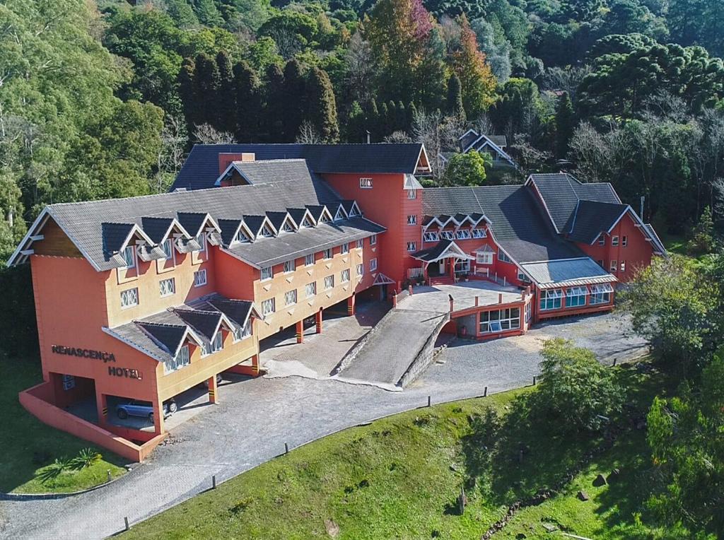 an aerial view of a large building with red at Hotel Renascença in Gramado