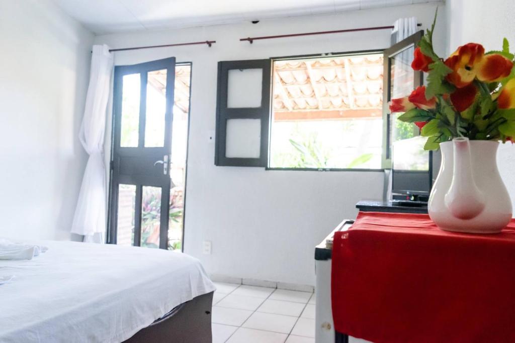 Postel nebo postele na pokoji v ubytování Pousada Nova Oasis do Rei