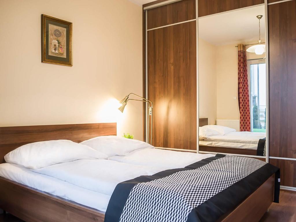 Postel nebo postele na pokoji v ubytování VacationClub - Stella Baltic Apartment 7