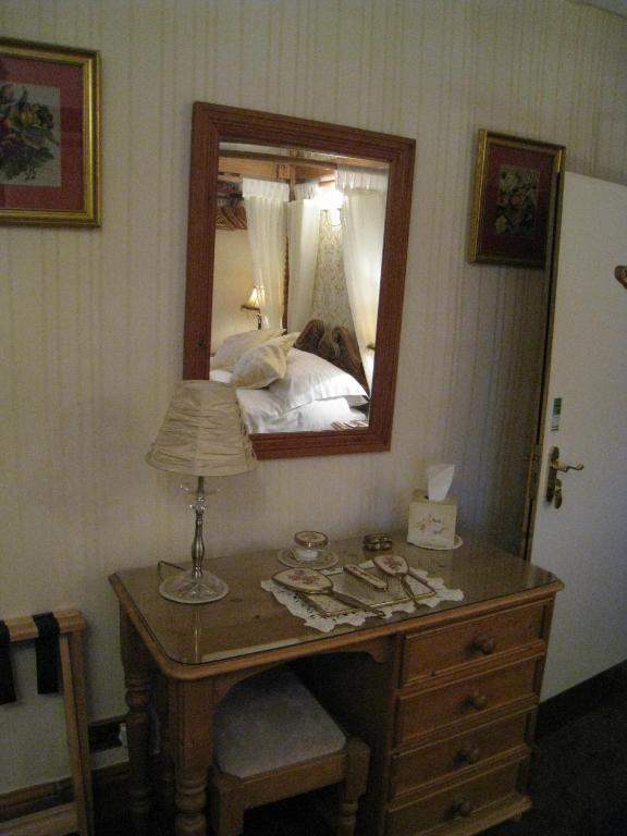 Postel nebo postele na pokoji v ubytování Rosebud Cottage Guest House