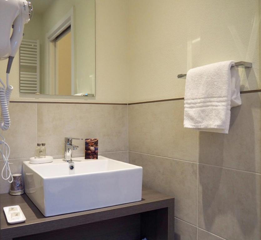 Koupelna v ubytování Hotel Riposo