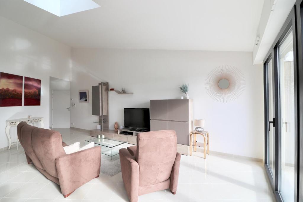 TV a/nebo společenská místnost v ubytování Appartement T4 Vue Unique