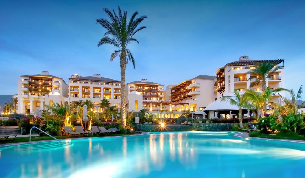 a large swimming pool in front of some buildings at Vincci Selección La Plantación del Sur in Adeje