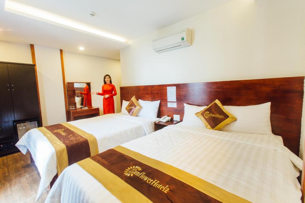 Postel nebo postele na pokoji v ubytování Sunflower Hotel 2