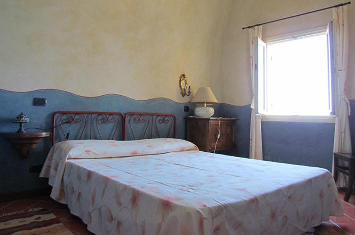 מיטה או מיטות בחדר ב-Gli appartamenti di Lorenzo