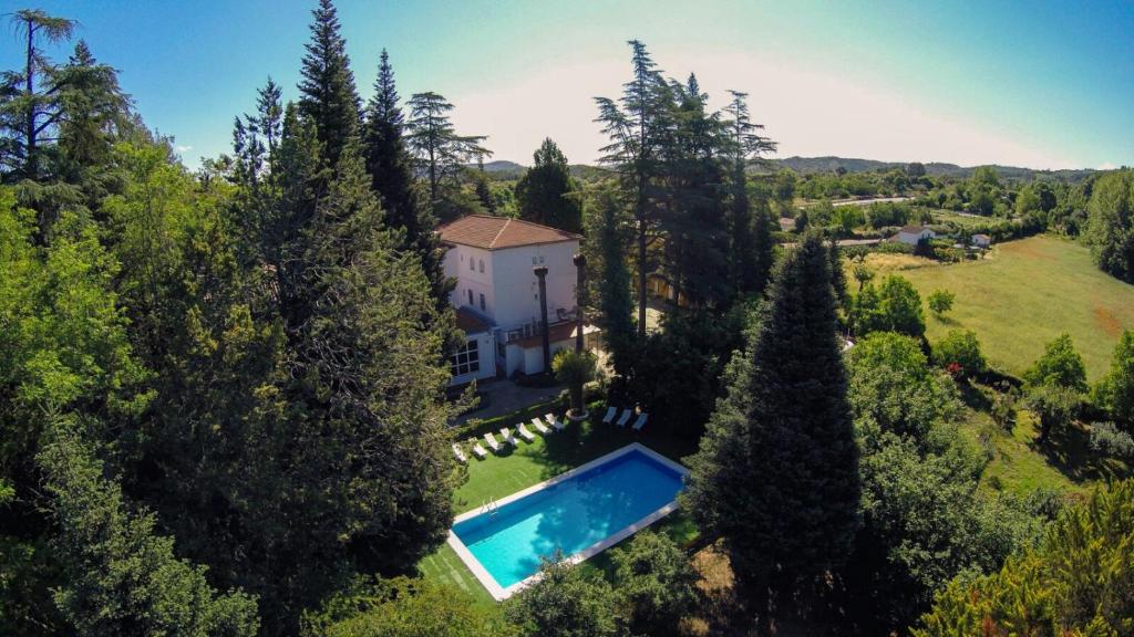 an aerial view of a house with a swimming pool at Hotel Rural Villa Onuba in Fuenteheridos