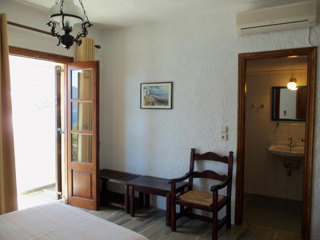 Postel nebo postele na pokoji v ubytování Alexandros Hotel