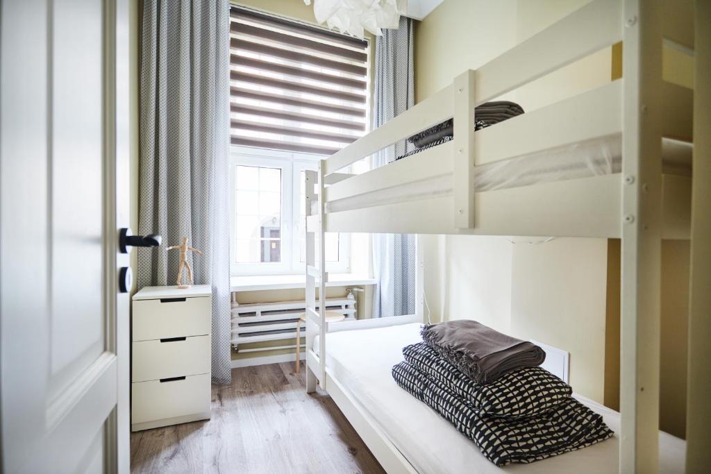 Posteľ alebo postele v izbe v ubytovaní Ropemaker Street Apartment