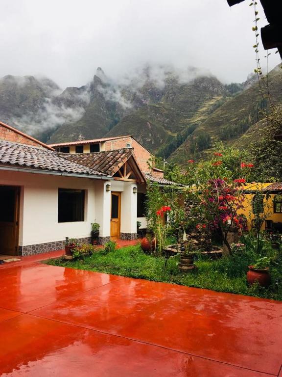 a house with a view of a mountain at La Casa de Adela Hospedaje in Pisac