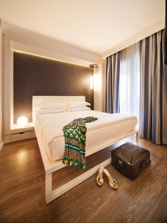 Postel nebo postele na pokoji v ubytování Oxygen Lifestyle Hotel