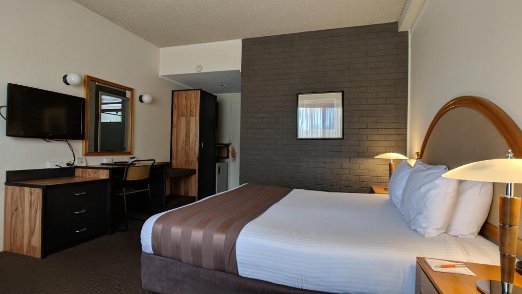 Postel nebo postele na pokoji v ubytování Quality Inn Dubbo International