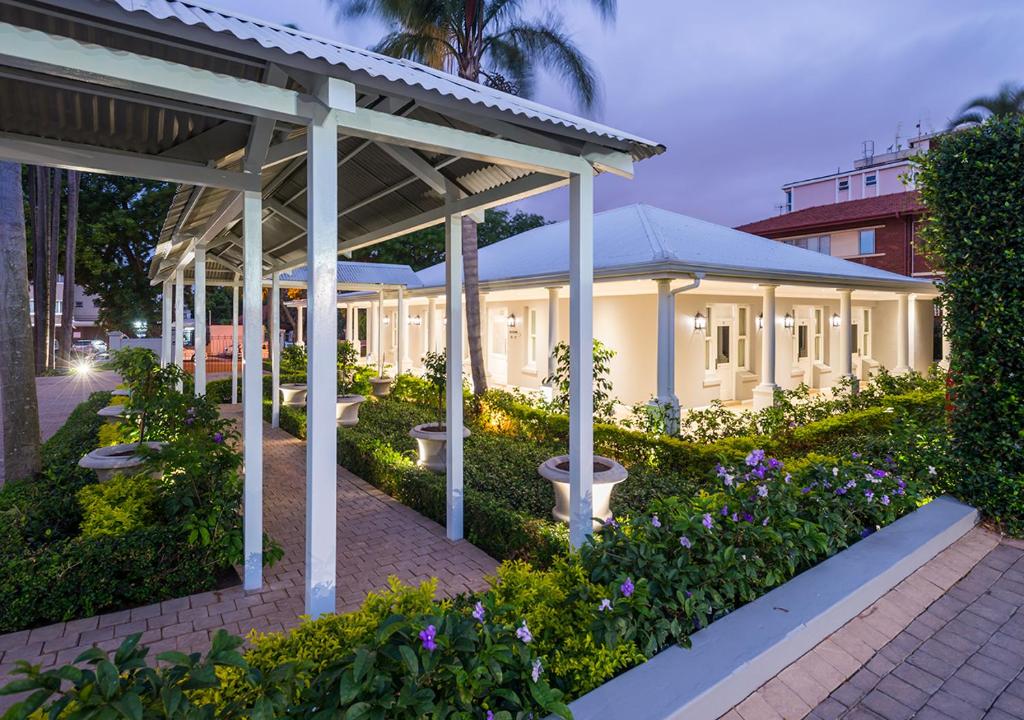 a building with a pavilion in a garden at Avondale Boutique Hotel in Durban