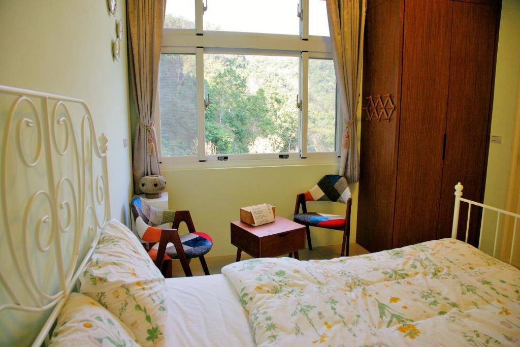 Postel nebo postele na pokoji v ubytování Yanzitao Pottery Coffee B&B