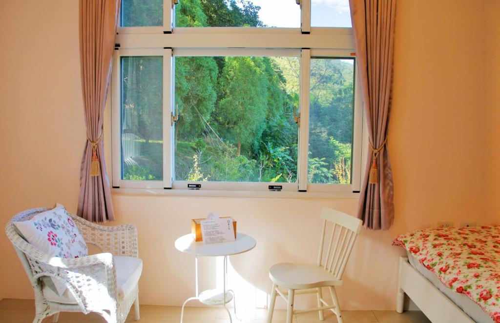 Postel nebo postele na pokoji v ubytování Yanzitao Pottery Coffee B&B