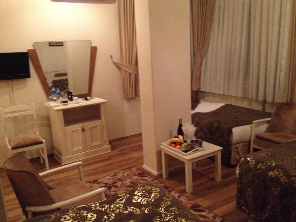 TV a/nebo společenská místnost v ubytování Tac Hotel