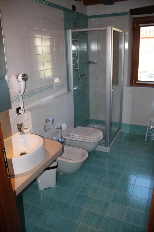 Koupelna v ubytování Hotel Le Macine
