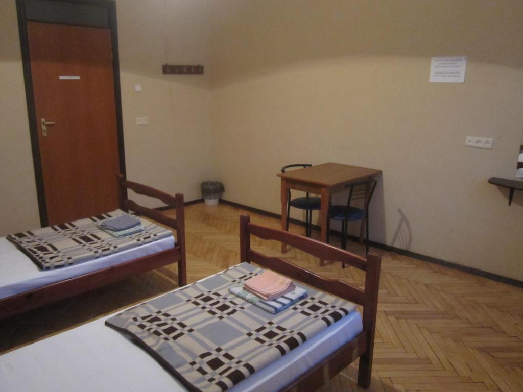 Postel nebo postele na pokoji v ubytování Yaroslav Hostel