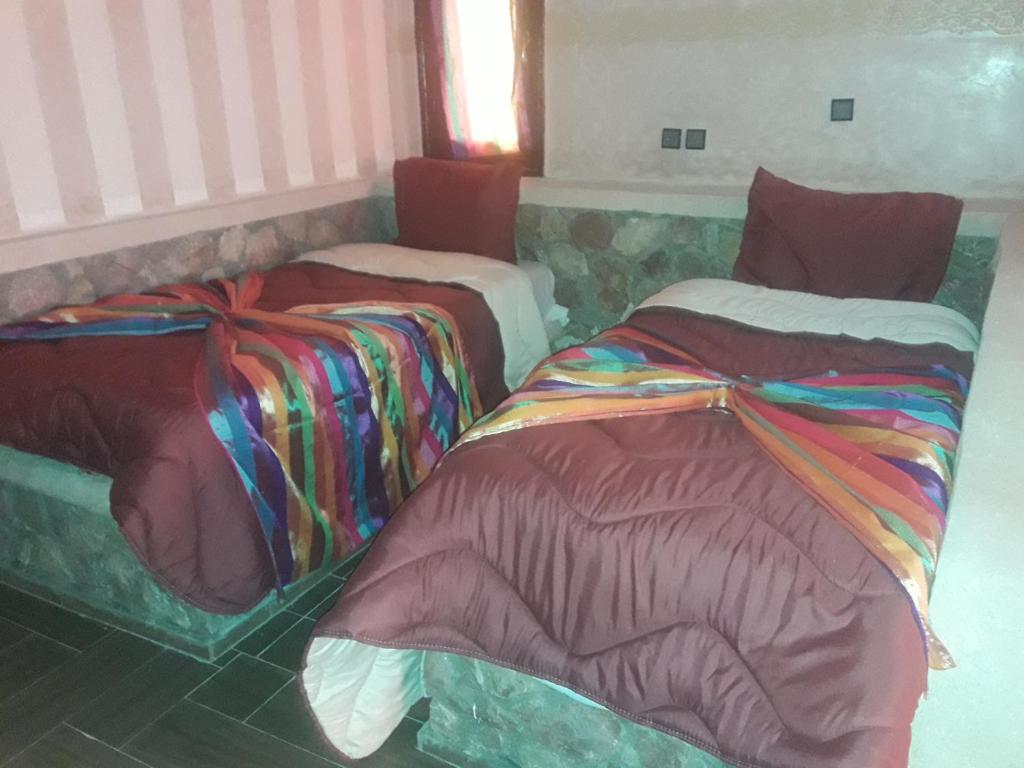 Postel nebo postele na pokoji v ubytování Hotel France Ouzoud