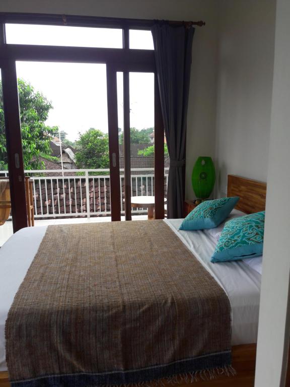 Postel nebo postele na pokoji v ubytování Undis Homestay