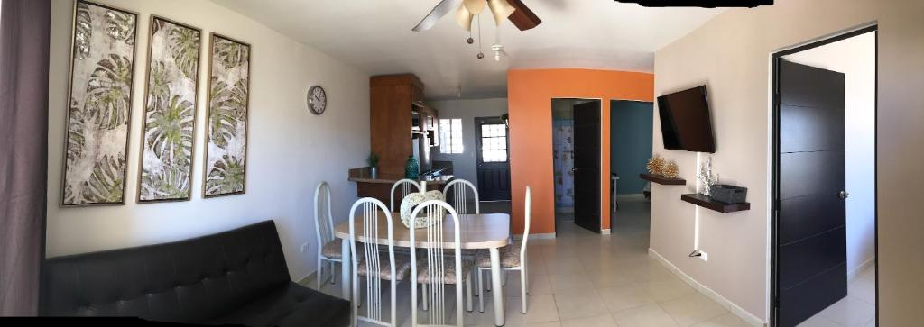 a living room with a table and a dining room at Fantastic & Cozy #3: Condo Close to the Beach in Ensenada