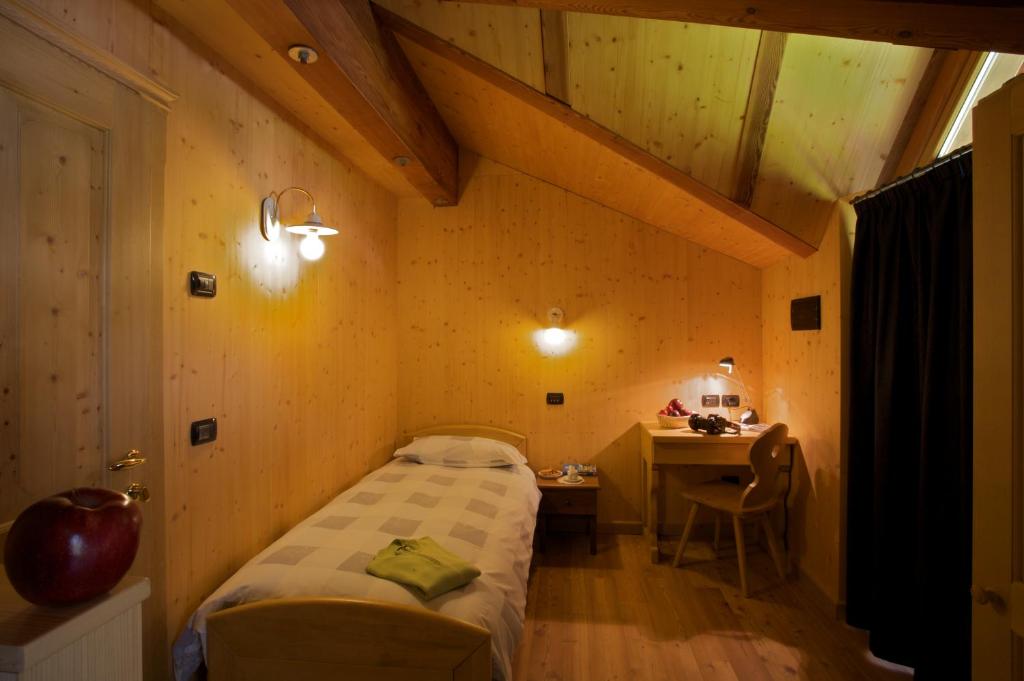 Postel nebo postele na pokoji v ubytování B&B Affittacamere Larix