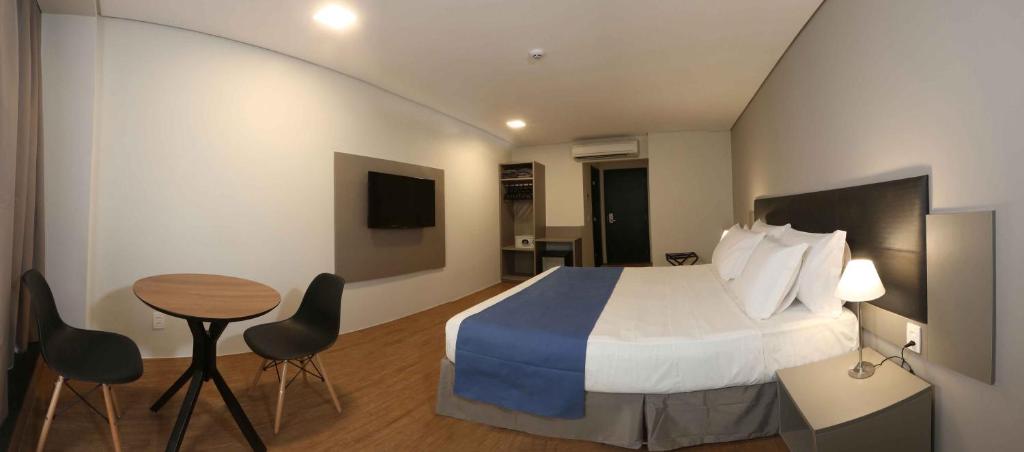 Cama ou camas em um quarto em Fity Hotel