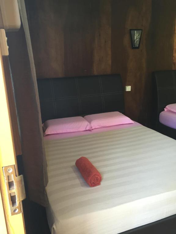 Postel nebo postele na pokoji v ubytování Samudra Beach Chalet