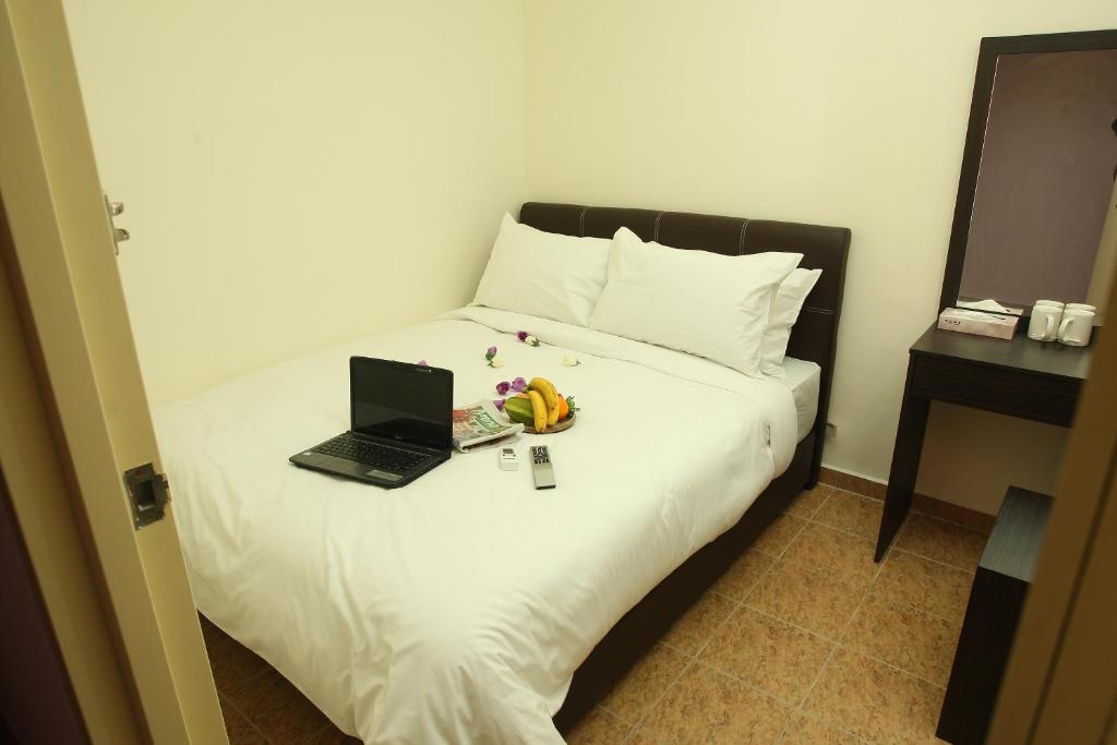 Postel nebo postele na pokoji v ubytování T-hotel JB