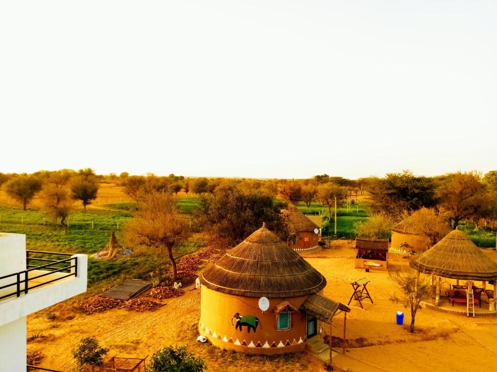 an aerial view of a building with a roof at Desert Nights in Mandāwa