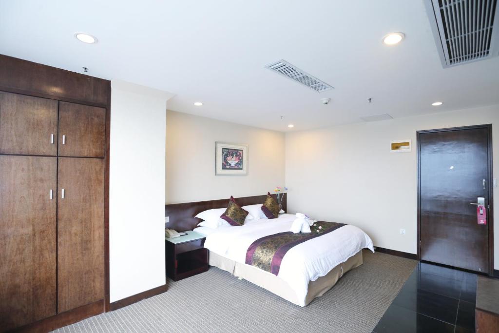 Postel nebo postele na pokoji v ubytování Yihe Hotel Ouzhuang