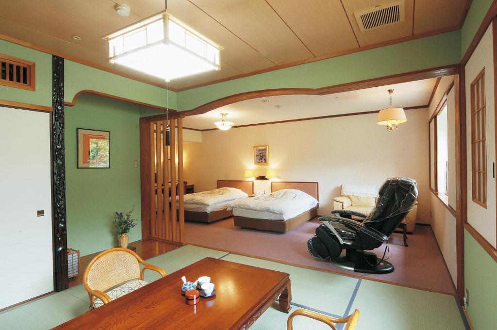 Postel nebo postele na pokoji v ubytování Watarase Onsen Hotel Sasayuri