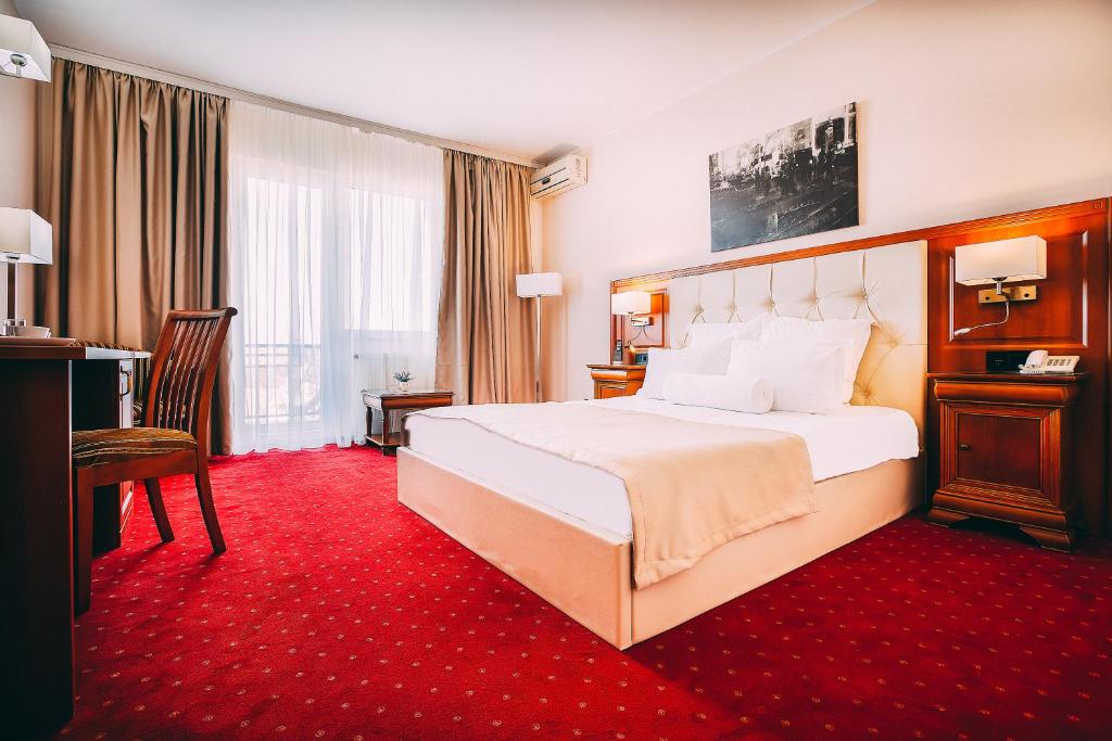 Postel nebo postele na pokoji v ubytování Hotel Athos R.M.T.