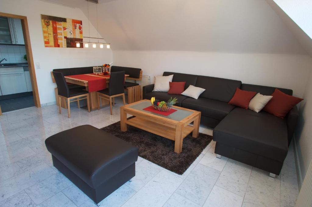 a living room with a couch and a table at Neumann Apartment in Marbach am Neckar