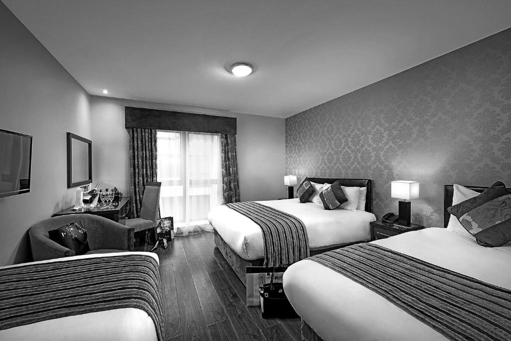 Postel nebo postele na pokoji v ubytování George Limerick Hotel