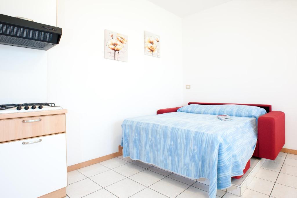 A bed or beds in a room at Welcome Residence per famiglie
