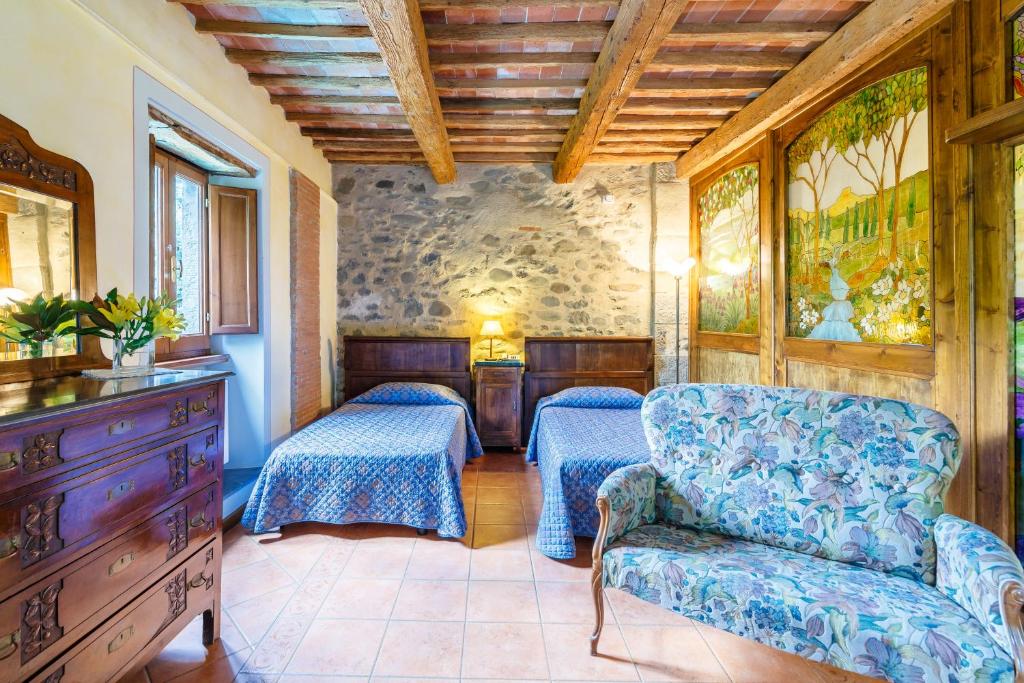 A bed or beds in a room at Villaggio Albergo San Lorenzo e Santa Caterina