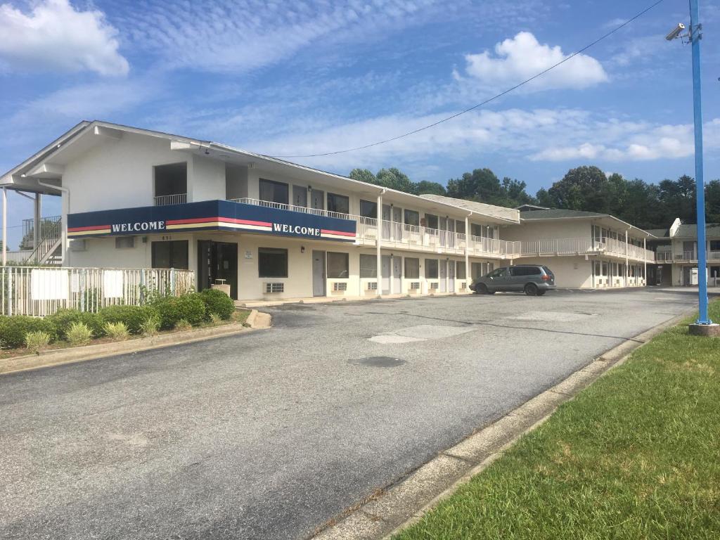 a hotel with a car parked in front of it at Travel Inn in Greensboro