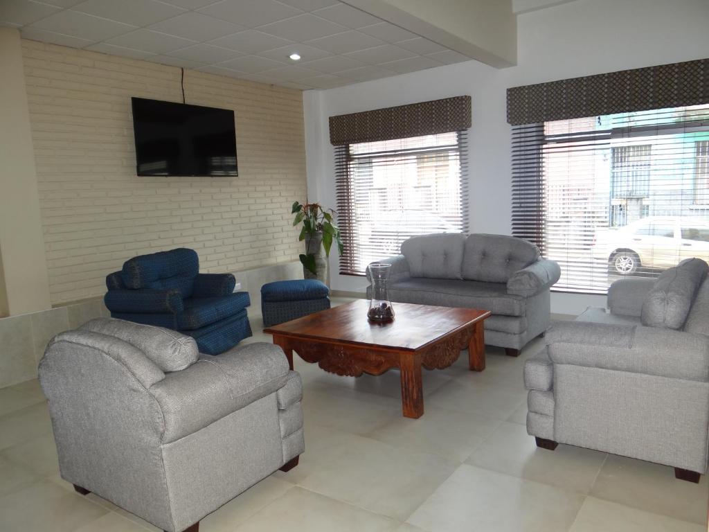 Χώρος καθιστικού στο Hotel Mac Arthur