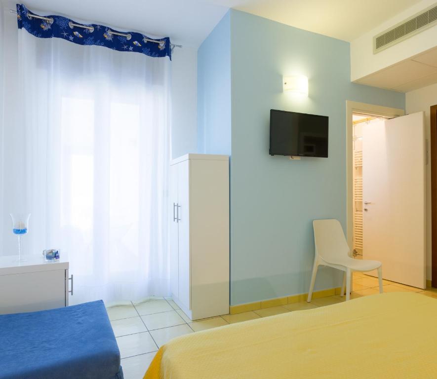 Postel nebo postele na pokoji v ubytování Gigli Hotel Salento