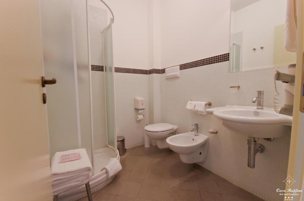 a bathroom with a sink and a toilet and a shower at B&B Casa Ruffino in Balestrate