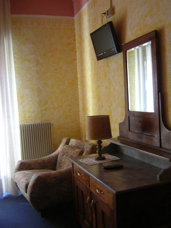 TV a/nebo společenská místnost v ubytování Albergo San Cristoforo