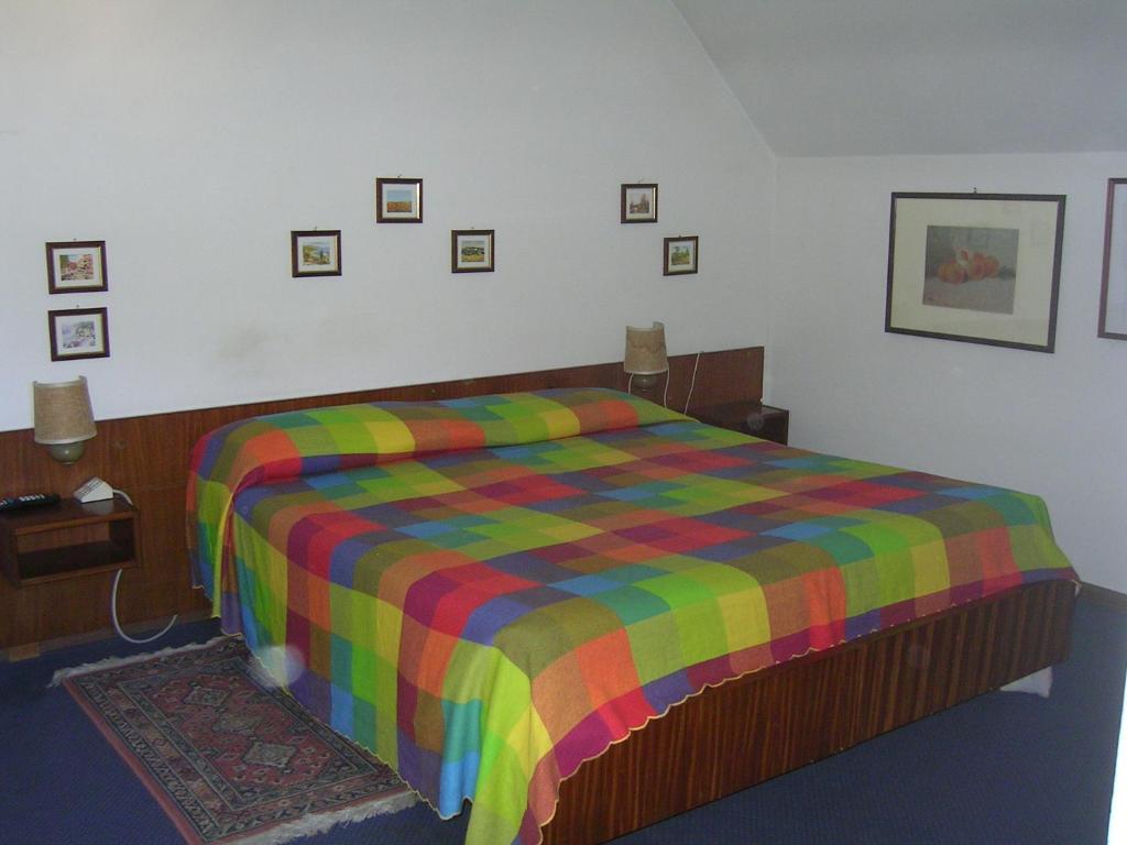Postel nebo postele na pokoji v ubytování Albergo San Cristoforo