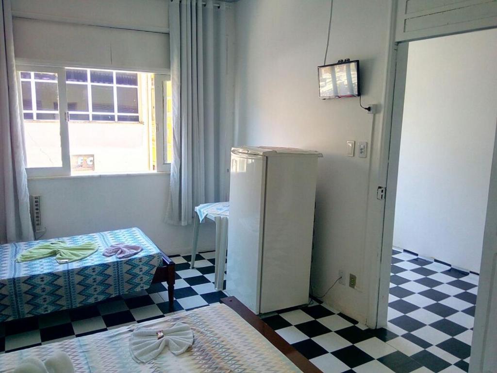 Postel nebo postele na pokoji v ubytování Britânia Hotel
