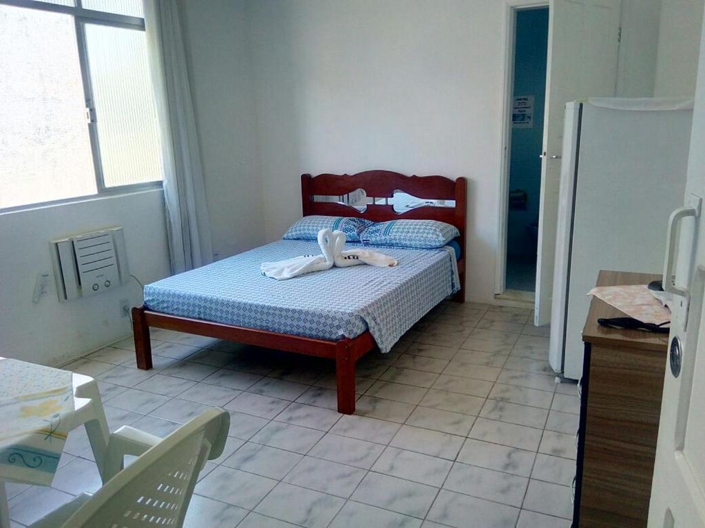 Postel nebo postele na pokoji v ubytování Britânia Hotel