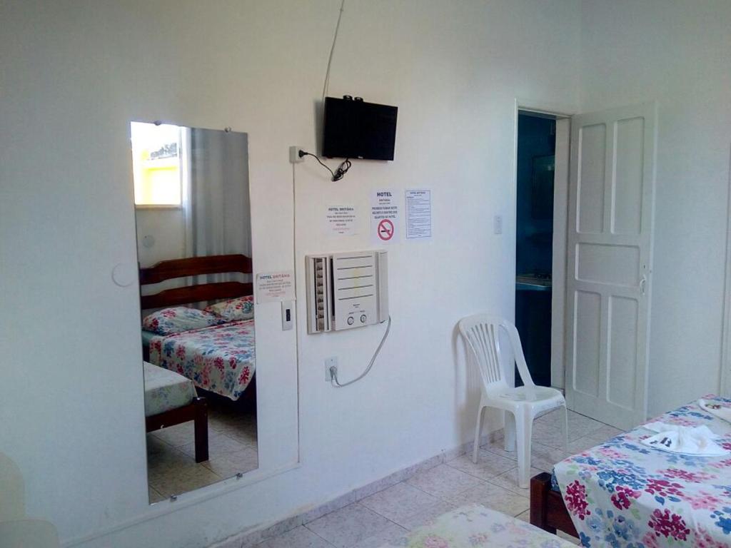Postel nebo postele na pokoji v ubytování Britânia Hotel