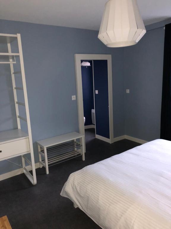 Postel nebo postele na pokoji v ubytování Lamarck Guest