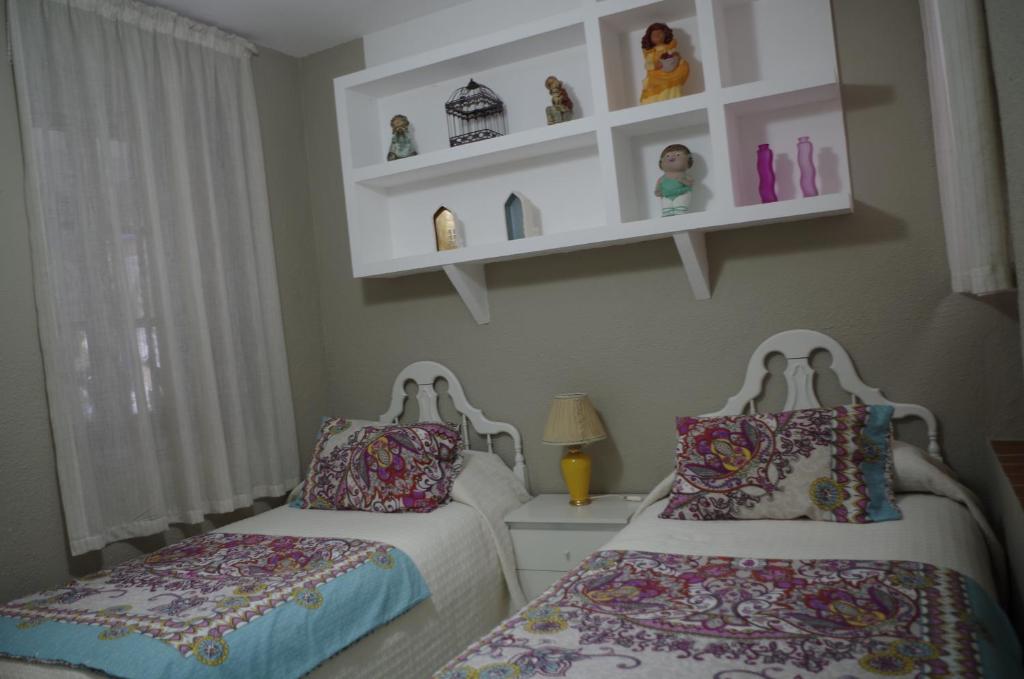 A bed or beds in a room at Alojamiento casa típica de Córdoba