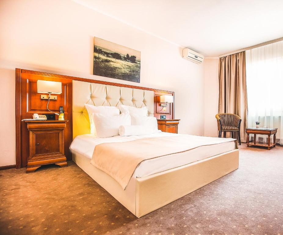 Postel nebo postele na pokoji v ubytování Hotel Athos R.M.T.