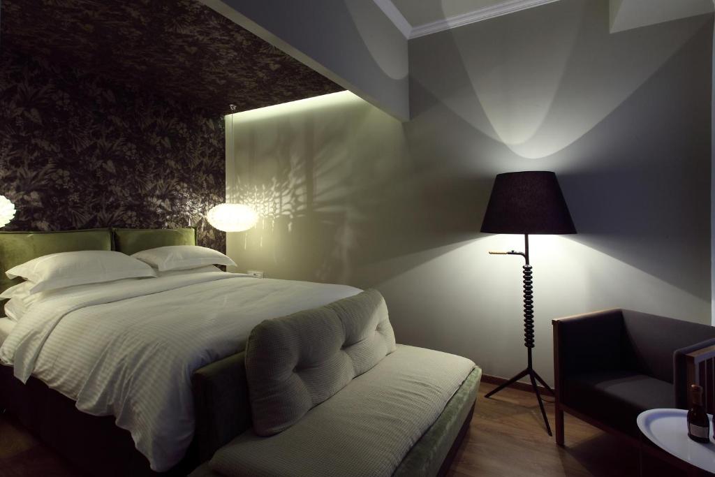 Postel nebo postele na pokoji v ubytování Hotel Metropolis
